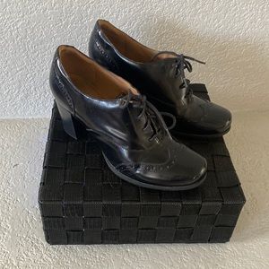 Clarks Artisan black leather Oxford size 9.5 Medium width and 3” heel.